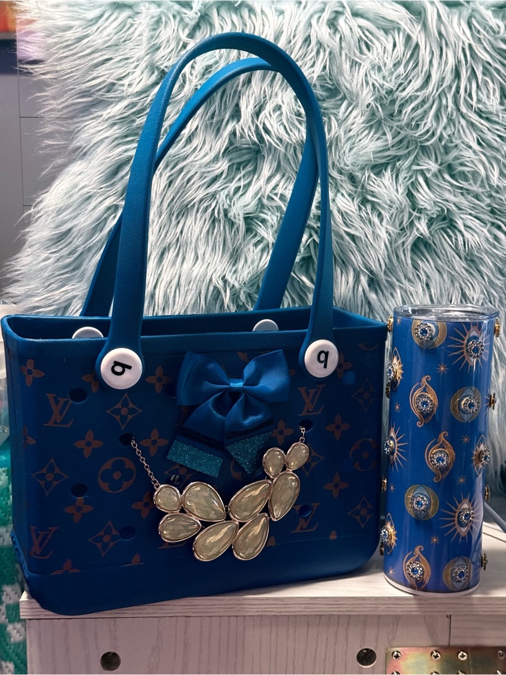 Blue Designer-Style Tote Bag with Decorative Bow and Pendant with tumbler